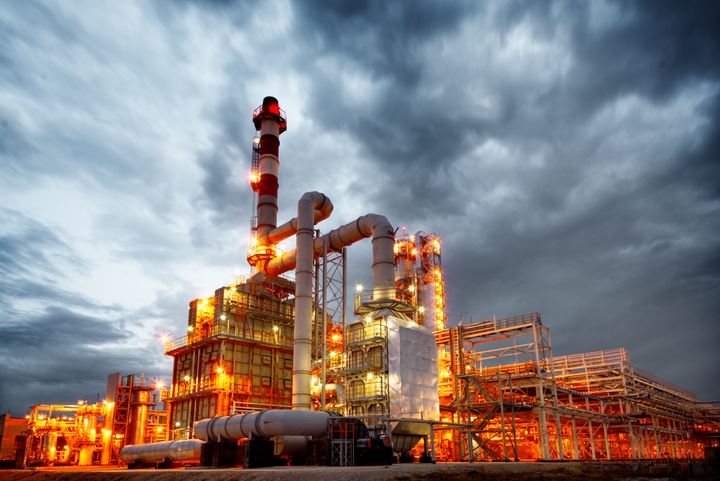 Illuminated petrochemical plant at dusk