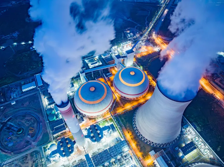 Cooling tower of a thermal power plant at night